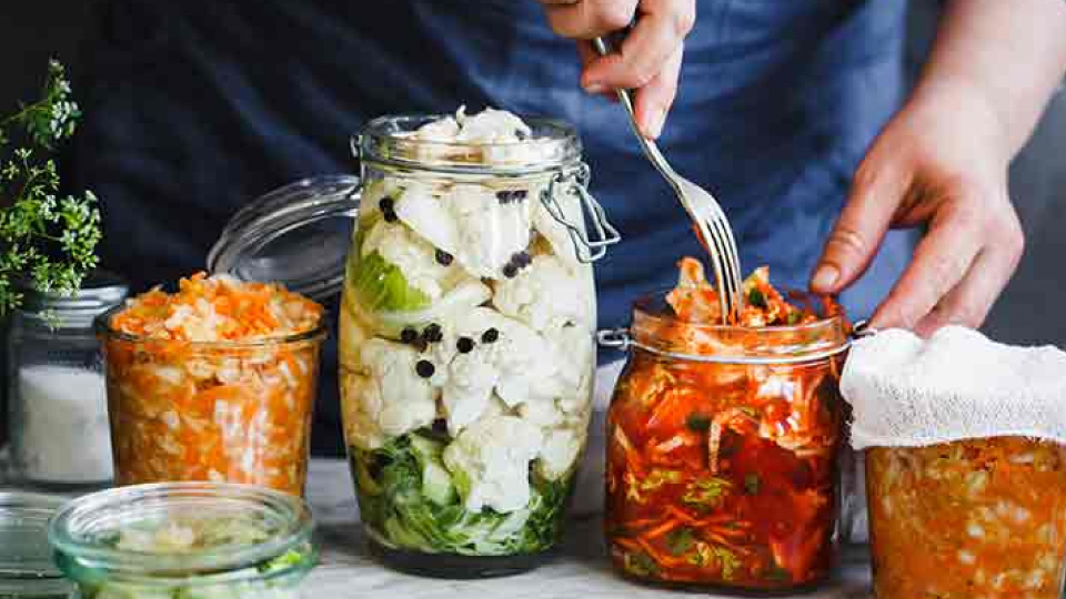 Jars of fermented vegetables, cauliflower, kimchi