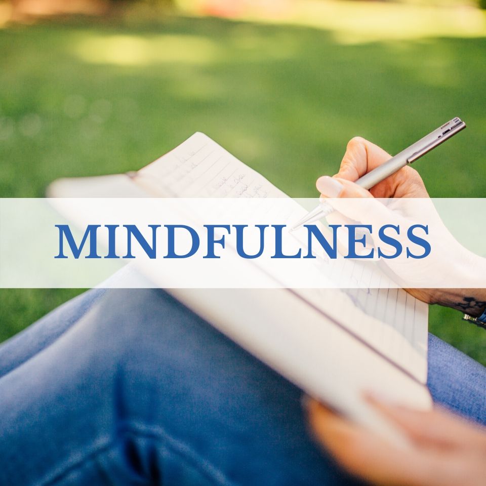 Mindfulness: writing in journal outside